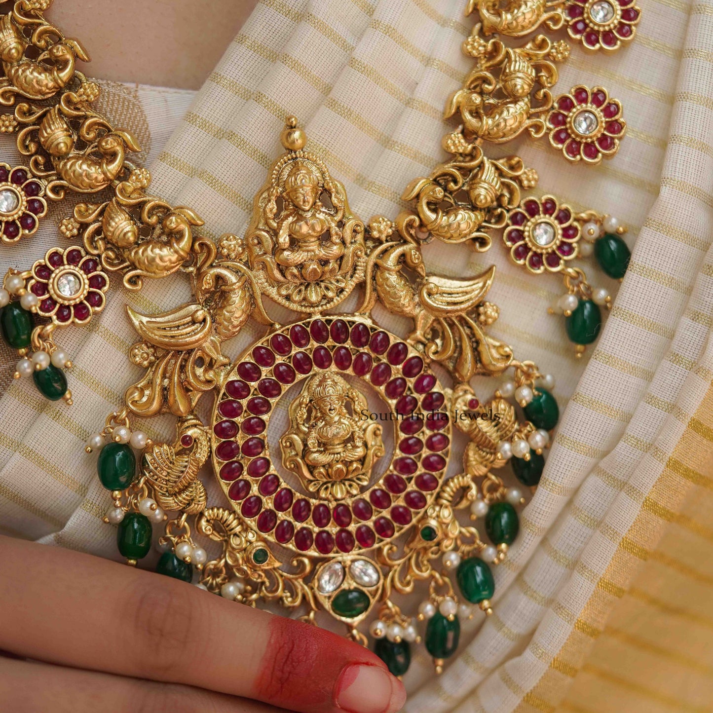 Mangalam peacock design kemp stone haram along with matching Earrings.