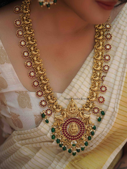Mangalam peacock design kemp stone haram along with matching Earrings.