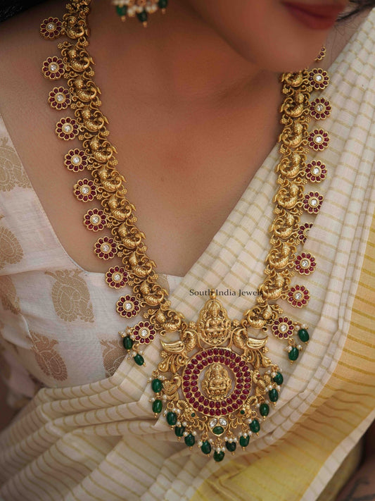 Mangalam peacock design kemp stone haram along with matching Earrings.